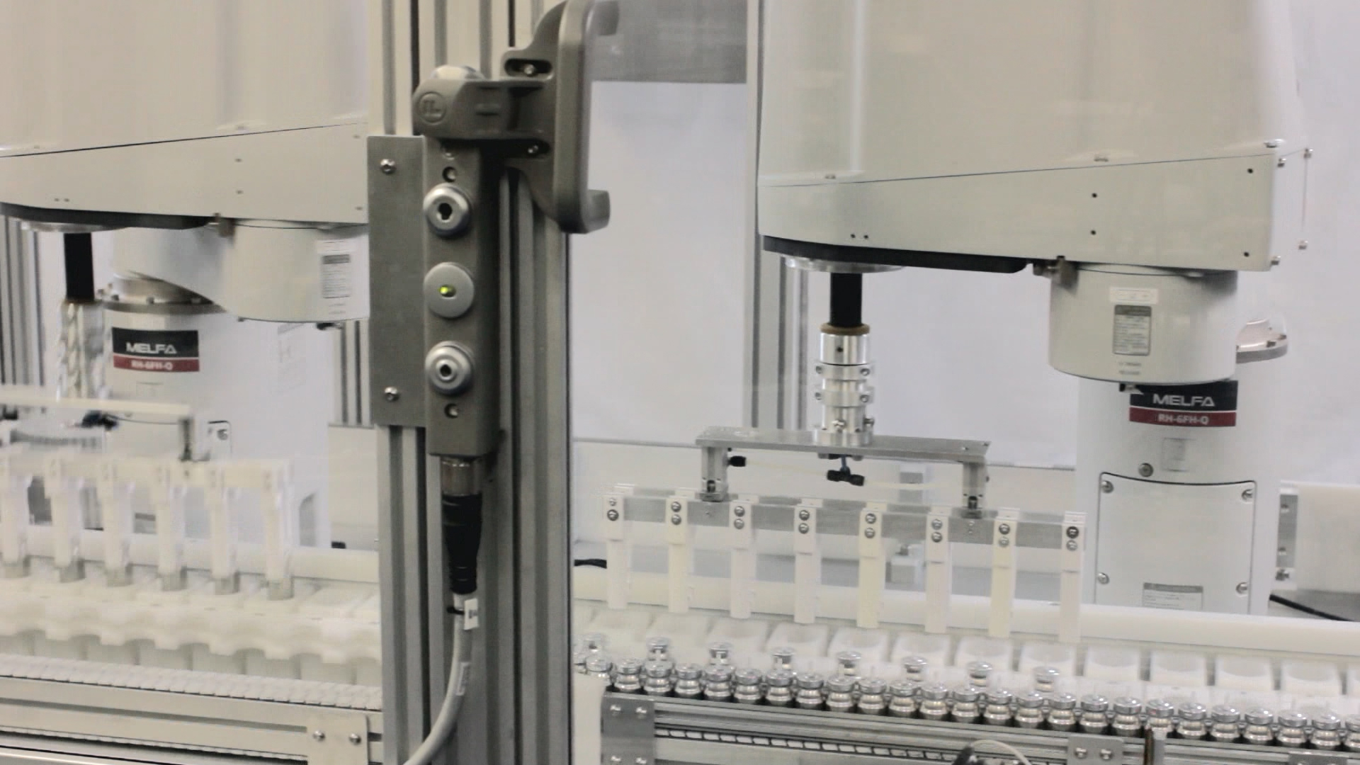 The SCARA robots are controlled by a powerful iQ Platform PLC allowing them to handle moving canisters without the need to stop the conveyor. [Source: Mitsubishi Electric Europe B.V.]