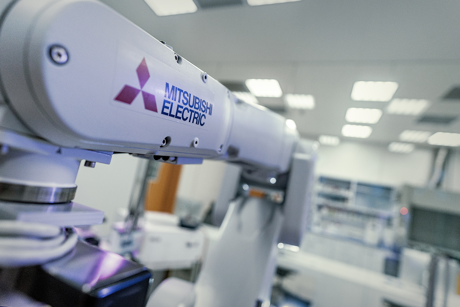 Mitsubishi Electric's industrial robot offers a long arm reach as well as an integrated set of robot-controlled tools for micro-scale test series on 96- and 384-well microassay plates. Source: Institute of Bioorganic Chemistry, Polish Academy of Science