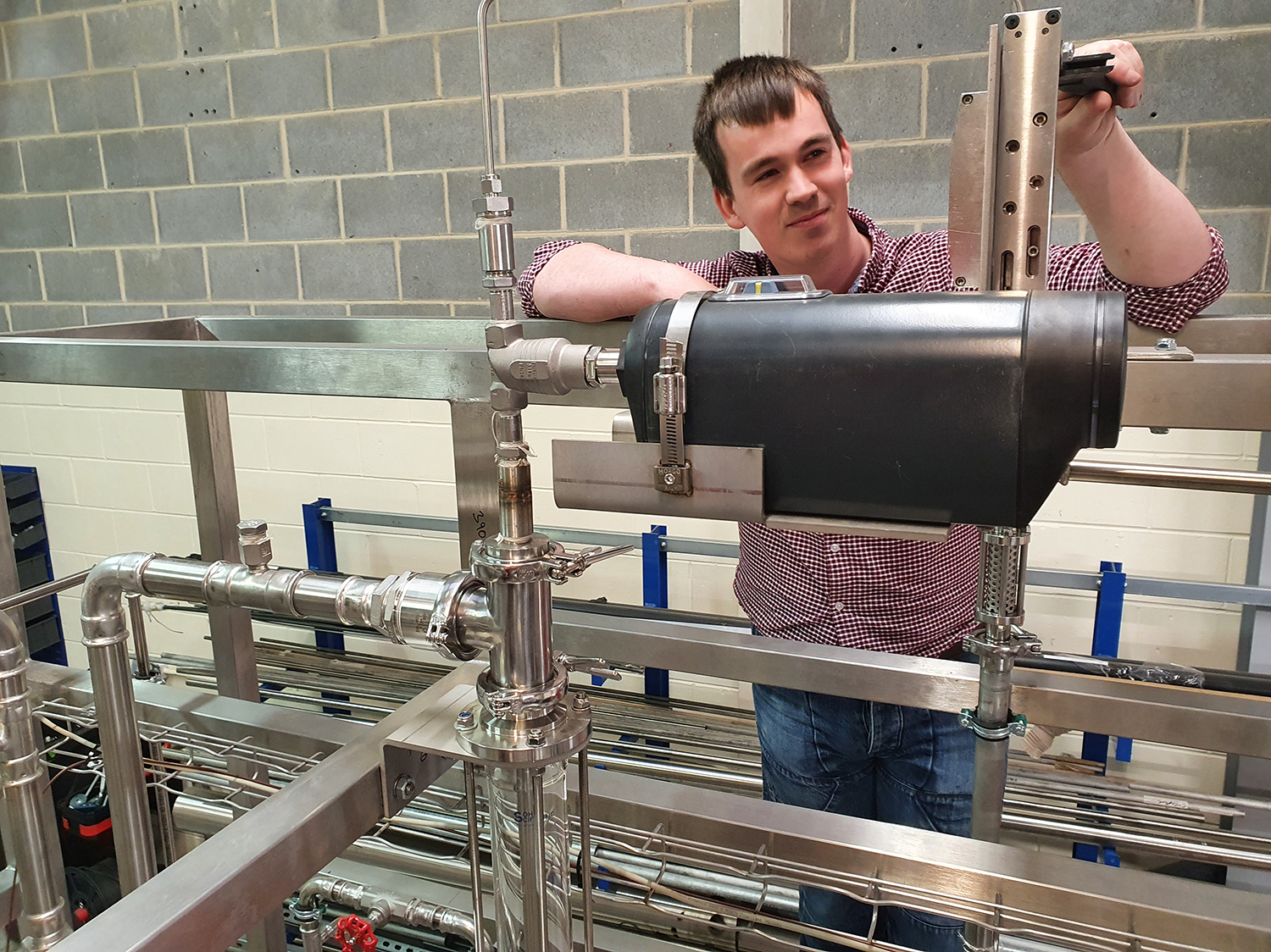 C-Capture process engineer John Mackay makes the final connection to the Burkert 3361 Electromotive 2-way globe control valve on the wetted wall column in C-Capture’s workshop.