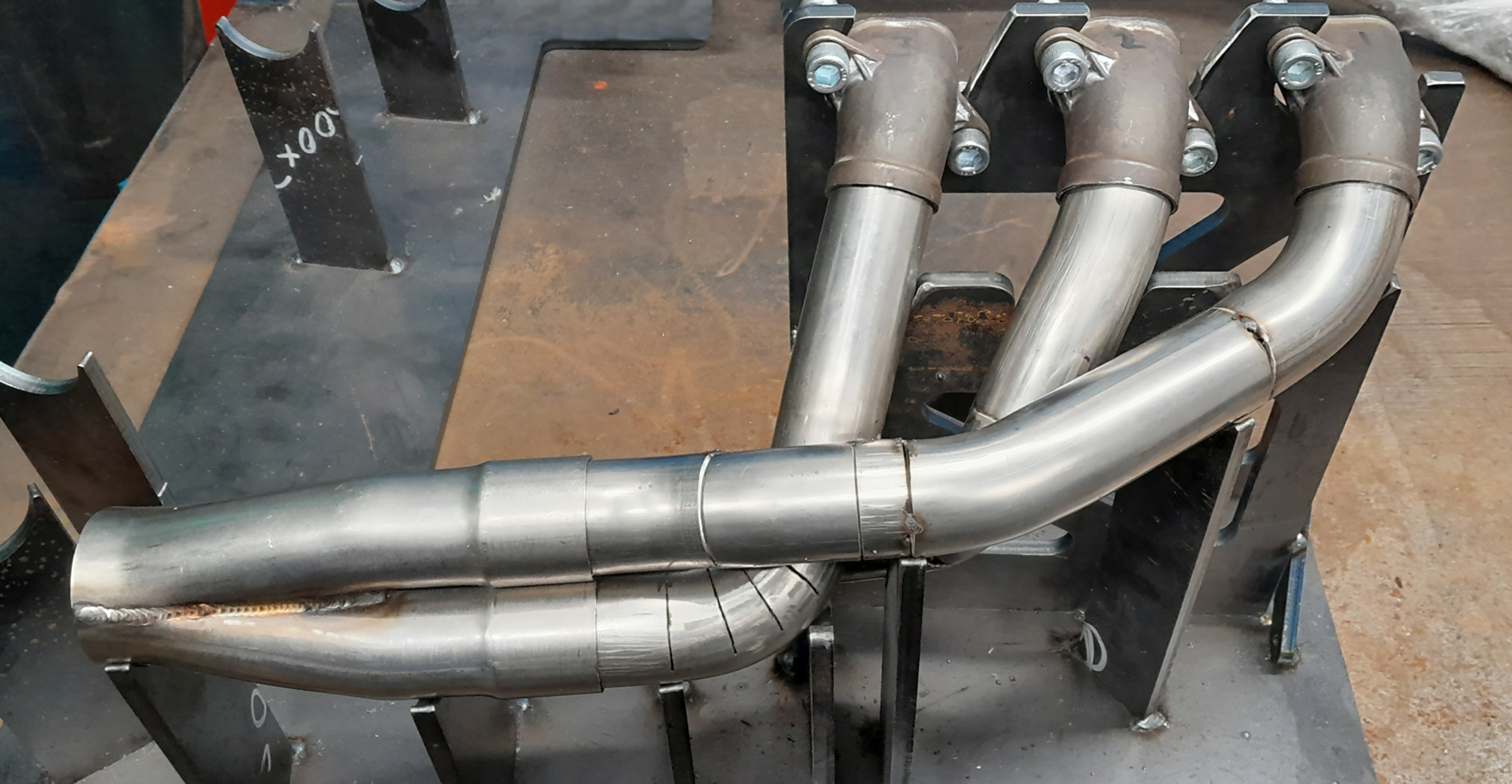 KMT produced a bespoke welding jig to allow assembly of a custom racing exhaust for the Staffordshire Uni Racing team