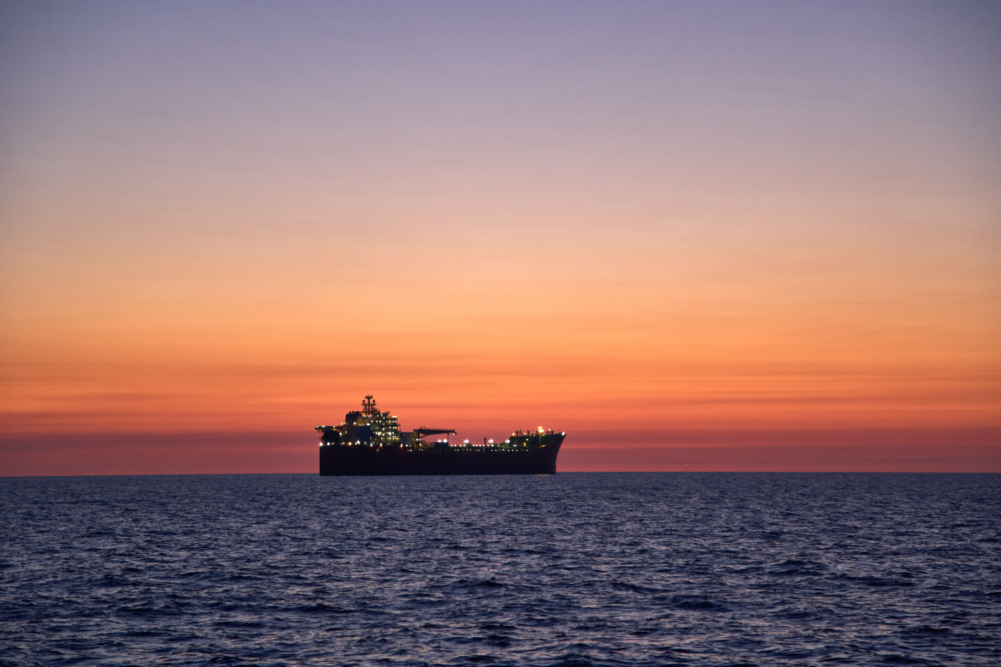 Floating production storage and offloading (FPSO) vessels are used around the world for processing oil and transferring this resource to tankers or pipelines that transport it to refineries. [Image source: shutterstock_1588458184]